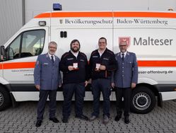 Übergabe der Verdienstmedaille