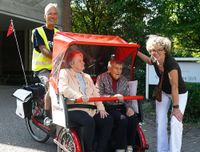 Rikscha mit Pilot und Gästen