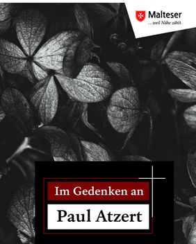Schwarze Hortensienblüten mit Aufschrift "Im Gedenken an Paul Atzert". Foto: pixabay
