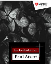 Schwarze Hortensienblüten mit Aufschrift "Im Gedenken an Paul Atzert". Foto: pixabay