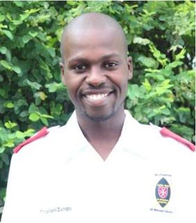 Thabani Zungu smiling in his care worker uniform; newsletter no. 36, 2017