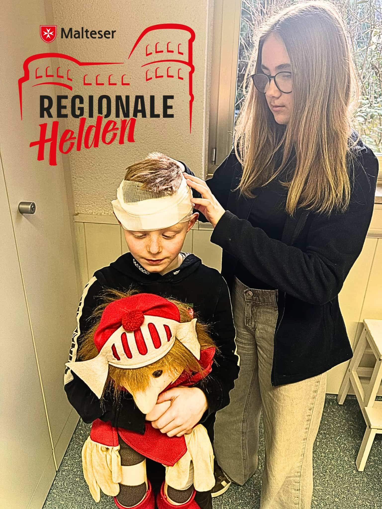 Nele legt einen Kopfverband an