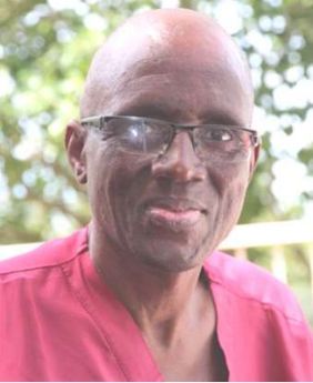 Wilfred wearing glasses and a red shirt; newsletter no. 36, 2017