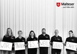 Lotsinnen und Lotsen der Malteser gemeinsam auf einem Postkartenmotiv.