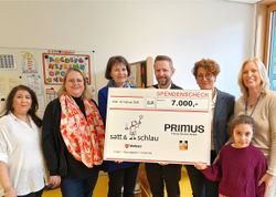 Symbolische Scheckübergabe der Primus Service GmbH an Malteser „satt & schlau“.