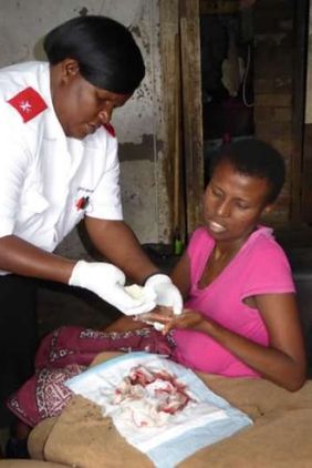 Home care nurse tends to Ngane’s hand; newsletter no. 35, 2016