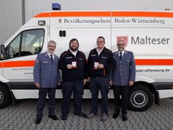 Übergabe der Verdienstmedaille