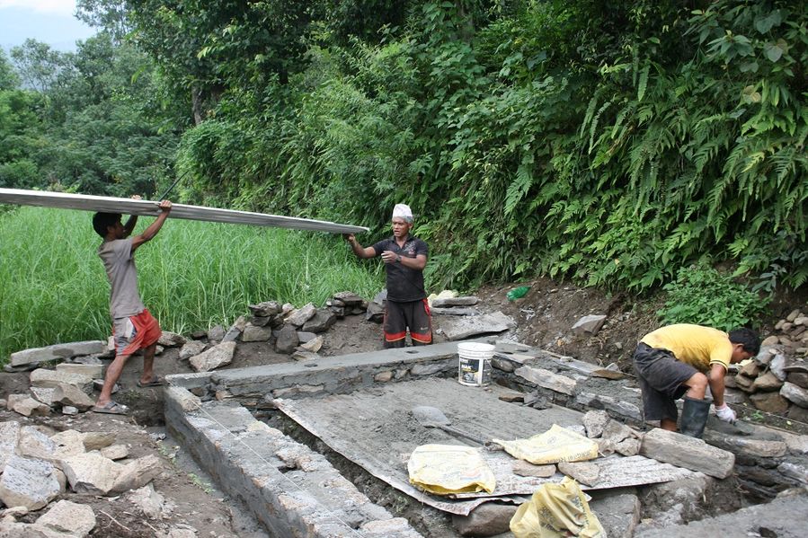 Singha at work on the foundations of Latima's new house.