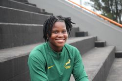 Mary Zulu lächelt im grünen Trikot der Springbok Women