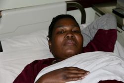 Nobuhle in a hospice bed; photograph from newsletter no. 37, 2018
