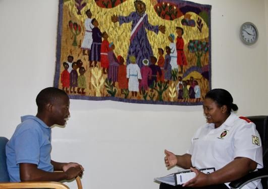 Phakamani Langa with a social worker