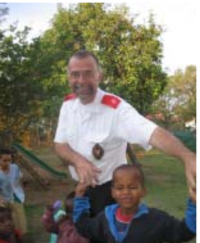 Deacon Thomas Müller stands with children outside the Children's Home in a 2005 archive photograph.