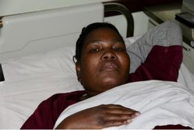 Nobuhle in a hospice bed; photograph from newsletter no. 37, 2018